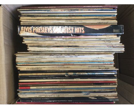 A box of Elvis Presley LPs.