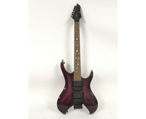 An Alden electric guitar fitted with a Floyd Rose locking system and having decorative mother of pearl inlays to fretboard. C