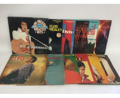 A box of Elvis Presley LPs, 7inch singles and 78s.