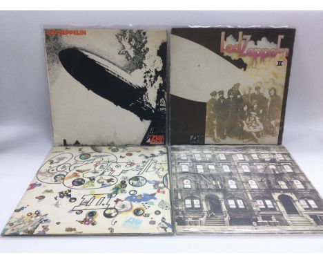 Four early UK pressings of Led Zeppelin LPs comprising the first three albums plus 'Physical Graffiti'. Red/plum Atlantic lab