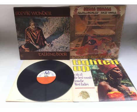 A collectable reggae LP on the Trojan label 'Psychedelic Teain' by Derrick Harriott, no sleeve and two feelable scratches tog