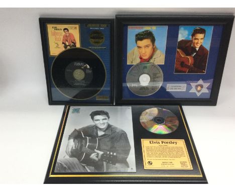 Three framed Elvis Presley presentation discs.