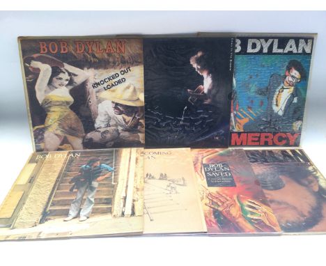 Seven Bob Dylan LPs comprising 'Infidels', 'Slow Train Coming', 'Street Legal' and others.