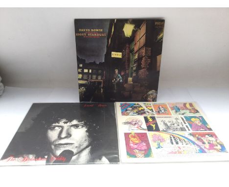 Three David Bowie LPs comprising a first UK pressing of 'Ziggy Stardust', NM, a rare German issued LP on the Deram label 'Ima