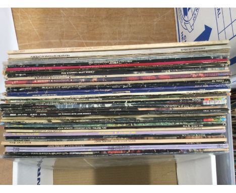 A box of LPs by various artists including Elvis Presley, Rod Stewart, John Denver and others.