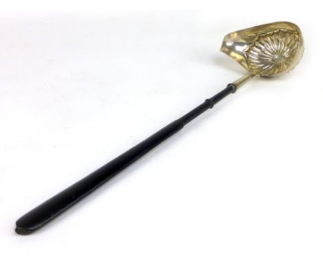 A Georgian style white metal toddy ladle with ebonised handle, indistinct marks