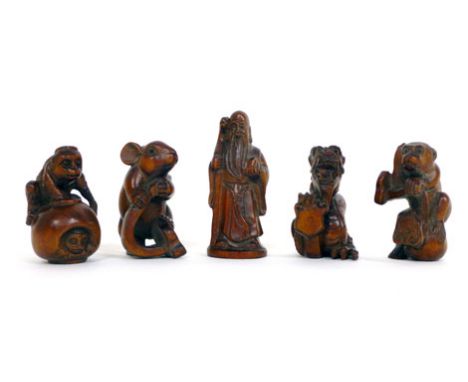 A collection of five wooden Netsuke modelled as animals and an immortal with inset mother of pearl signature buttons (5) 