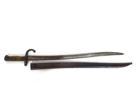 A 19th century French Chassepot sword bayonet with proof marks and an inscription dated 1874 to the slightly curved blade and