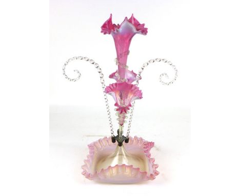 A Victorian pink vaseline and clear glass epergne, the central trumpet vase flanked by a further pair of vases in a pair of h