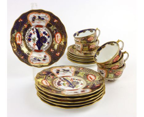 A Royal Crown Derby part tea set in an Imari pattern, 4591, including six side plates, six saucers and five cups with printed