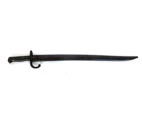 A late 19th century French Chassepot sword bayonet with scabbard, proof marks to the curved blade, working button, l. 22.5 in