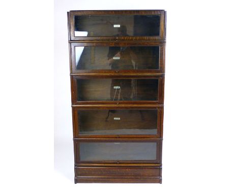 A Globe Wernicke oak five tier book case with base and top, h. 170 cm CONDITION REPORT: Wear typical for age some deteriorati