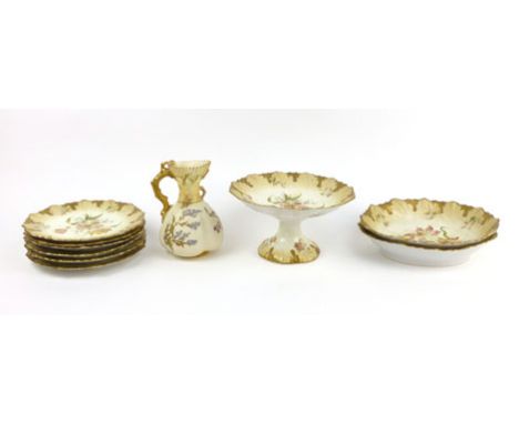 A continental blush ivory dessert set decorated with flowers in a moulded border, including six plates, two oval dishes and a