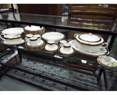 A quantity of Noritake dinner ware in the Gold and Sable pattern to include 6 large plates, 6 bowls, 6 medium plates, 6 small