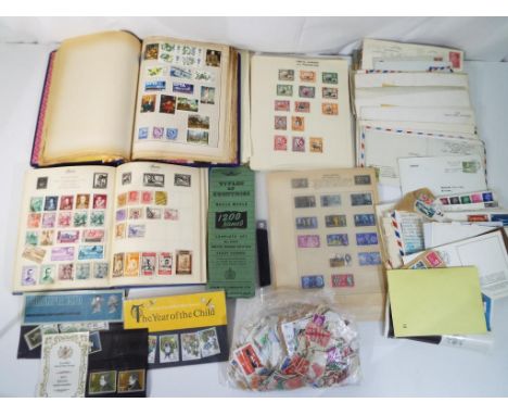 Philately - a lot to include three albums, containing UK and World postage stamps, pre and post decimal UK stamps, small quan