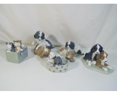 Nao - five ceramic figurines by Nao, depicting puppies and kittens, largest approximately 13.5 cm [h] [5], Est £25 - £50.