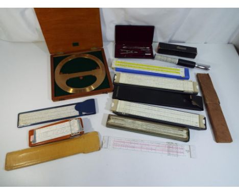 A lot to include an Otis King patent calculator model K in original box, a cased set of drawing instruments, slide rules and 