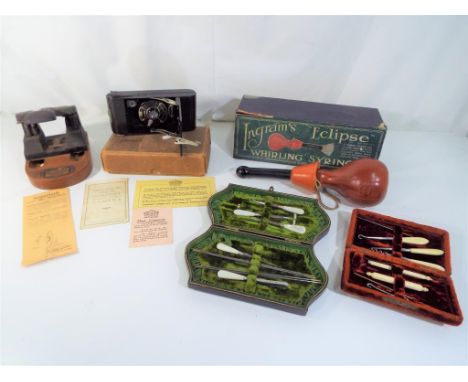 A mixed lot of vintage items to include a coronet, a folding pocket camera, a bullfinch hole punch, an Ingrams Eclipse whirli