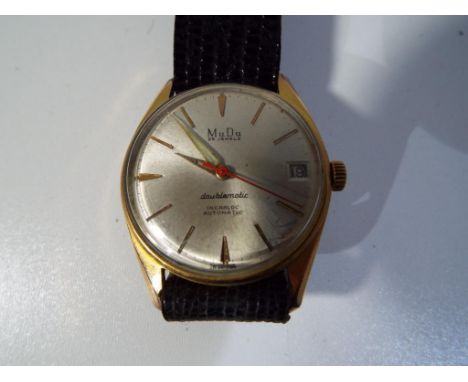 A gentleman's vintage MuDu 25 jewel Swiss Made doublematic wristwatch, baton hour markers, date aperture at No. 3. Estimate £