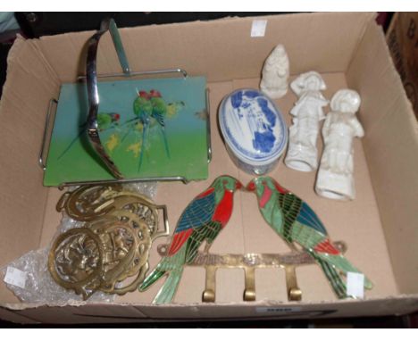 A box containing a quantity of horse brasses, ceramic figures, etc.