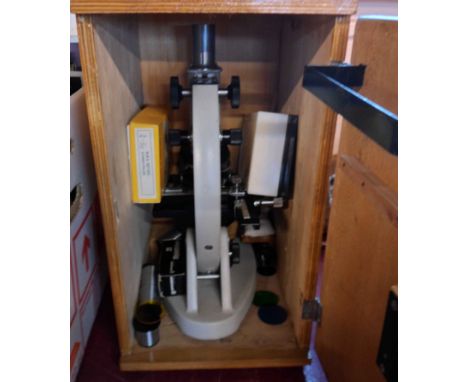 A vintage wooden cased Paralux PCB 1600X microscope with accessories and slides
