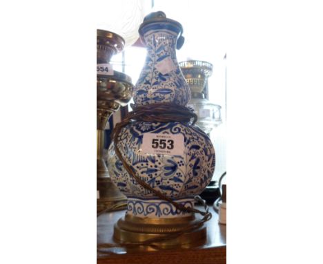 An antique Dutch Delftware lobed vase - converted to an electric table lamp with brass fittings