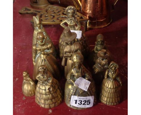 Ten vintage cast brass figural table bells of various size and design