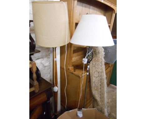 An oak standard lamp - sold with a modern brushed silvered metal similar - both with shades