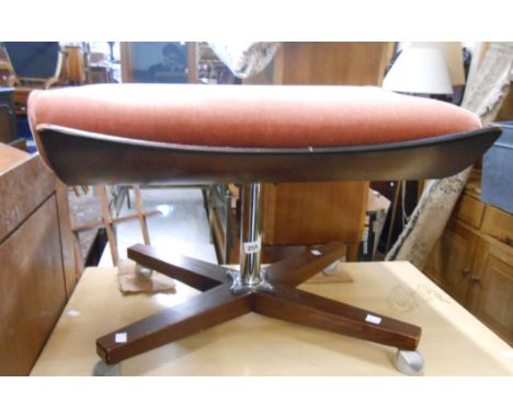 A retro G-Plan dressing stool with old rose upholstery and bentwood top, set on a chrome plated pillar and quadruple polished