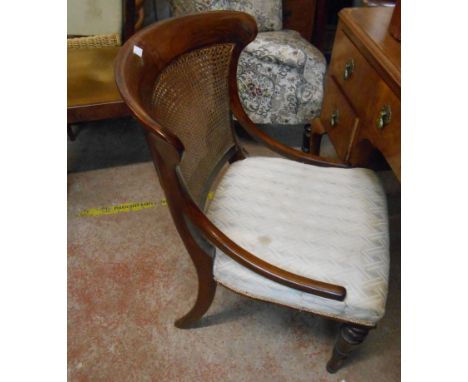 A 19th Century rosewood framed rattan panel back chair with swept side rails and upholstered seat, set on turned front legs