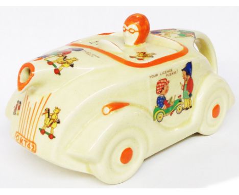 An Art Deco Sadler 'OKT42' novelty teapot in the form of a vintage Roadster with all over nursery rhyme transfer printed vign