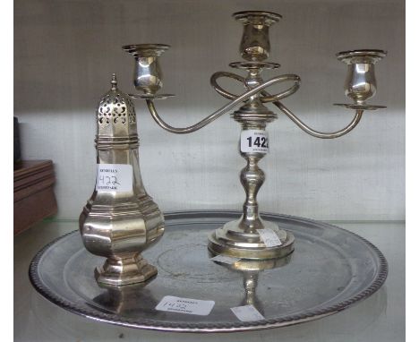 A silver plated twin branch three light candelabrum - sold with a plated sugar caster and tray