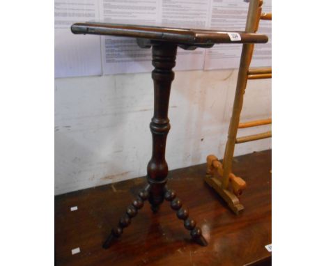 A Victorian mahogany pedestal table with hexagonal top, set on turned pillar and bobbin turned tripod legs
