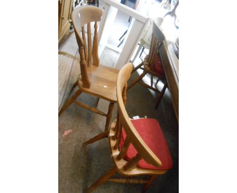 Seven matching blonde wood Windsor style lathe back kitchen chairs with solid sectional seats, set on ring turned legs