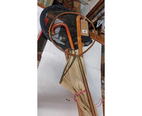 A vintage cane fishing net frame - sold with another similar with later nylon net, a walking stick and a parasol