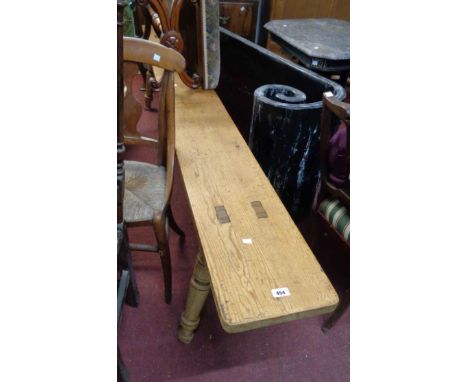 A vintage pine form set on turned supports - 2.60m long