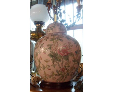 A modern Chinese porcelain table lamp in the form of a ginger jar and lid with brass fittings and hardwood stand