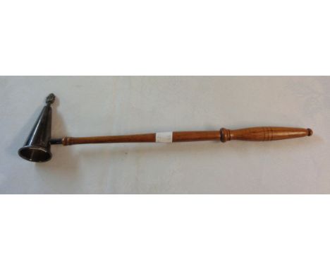 A silver candle snuffer with flambeau finial on turned fruitwood handle