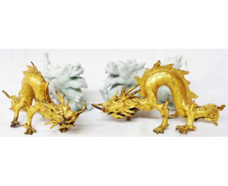 A pair of antique gilt bronze dragon pattern handles in the Chinese taste - sold with a pair of celadon glazed porcelain drag