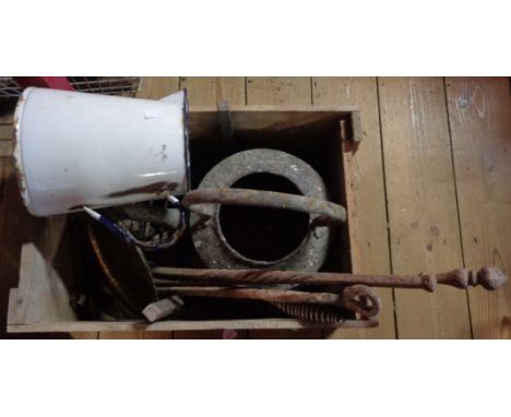 An old wooden advertising crate containing a quantity of metalware including cast iron kettle (a/f), wrought iron trivet, pok