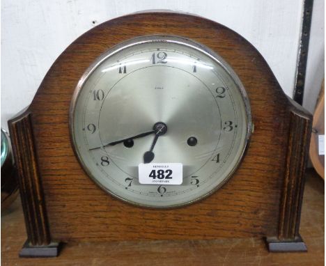 A vintage oak cased mantle clock with Enfield eight day gong striking movement