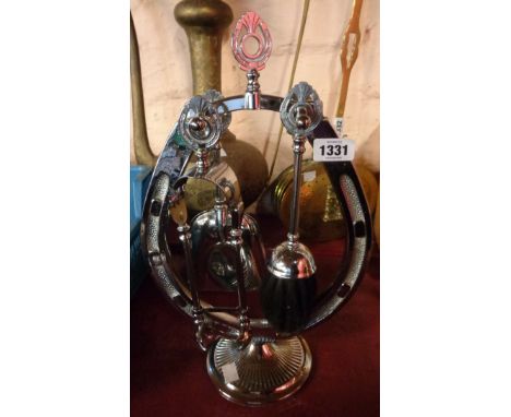 A vintage chrome plated companion set of horseshoe form