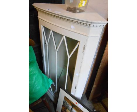 A 58cm vintage later painted corner cabinet with glazed panel door, set on bracket base