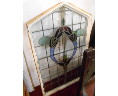A late Victorian stained and leaded glass light panel with canted top and stylised floral decoration - 1.18m X 72cm - 2 panes
