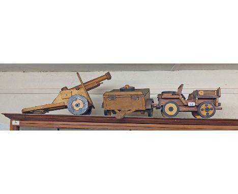 A scratch built wooden model of an army jeep with trailer and tow-away field gun