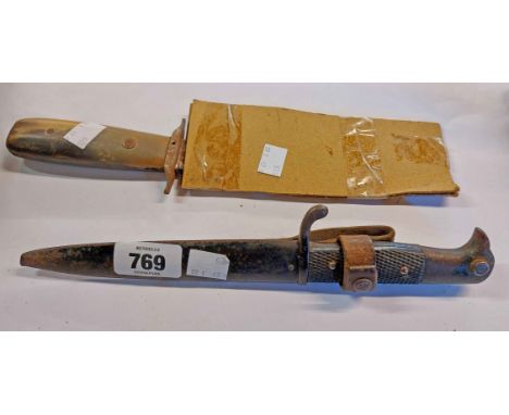 A WWII period German Eagle hilt headed dagger and scabbard - sold with a horn handled dagger (no scabbard)