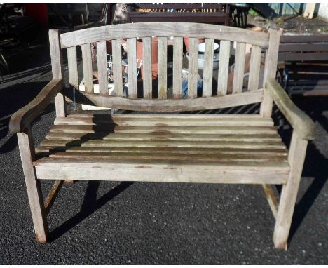A Lindsay teak two seater garden bench