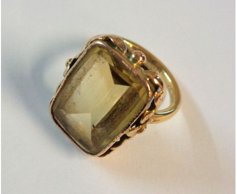 An 18ct. gold dress ring, set with a large oblong citrine stone - boxed