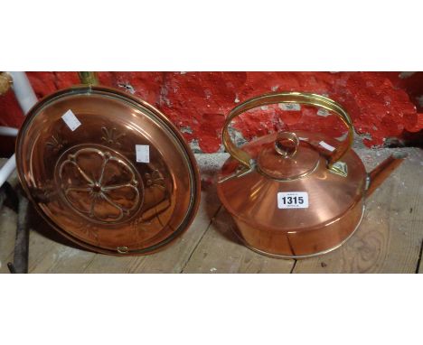 An old copper kettle - sold with a copper warming pan