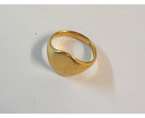 An 18ct. gold signet ring with blank cartouche - boxed